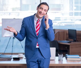 Sticker - Young handsome businessman sitting in the office