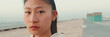 © Andrii Nekrasov - Close up of asian girl wearing sportswear looking at camera on morning time, Panorama