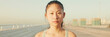 © Andrii Nekrasov - Close up, asian girl in sports top looks at the camera, Panorama
