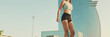 © Andrii Nekrasov - Asian girl in sports top does workout, squats, quadriceps exercises at morning time, Panorama
