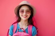 Happy young Asian female tourists wear beach hats, sunglasses and backpacks on holiday trips.