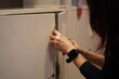 © pixs4u - woman open or close storage cabinet door