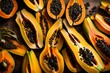 The stunning contrast between the bright yellow flesh and dark seeds of a halved papaya.