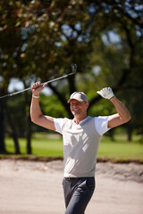 Happy man, celebration and golfer with fist pump for winning, victory or shot in sand pit. Excited male person or sports player with smile for achievement, score or point on golf course in nature