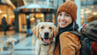happy traveler with her Labrador in a pet-friendly hotel entrance