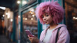 A woman with pink hair is holding a pink phone