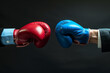© nunkung07 - A close-up shot of a business person on the left, wearing red boxing gloves, in a guard position with their glove touching the blue-gloved hand of another business person on the right.