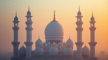 Golden Minarets Rising Above White Domes Against A Muted Backdrop