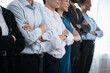 © Summit Art Creations - Diverse group of professional business people stand in line with cross arm gesture in modern corporate office. Happy and smiling multiracial office worker team bond and succeed together. Concord