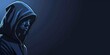 Portrait of hooded thief on the left side isolated on the dark blue background with copy space, crime concept