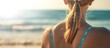 woman on her back on the beach sunbathing