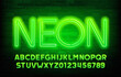Neon alphabet font. Green neon color letters and numbers. Stock vector typescript for your design.
