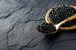 black caviar and a gold spoon on the table, black caviar closeup, caviar closeup, healthy food, expensive foods caviar, caviar on a black background 