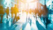 © kittikunfoto - Busy urban corridor with blurred pedestrians in motion, bathed in sunlight reflecting off modern skyscrapers, evoking bustling city life.