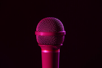 Wall Mural - Modern microphone on dark background, closeup