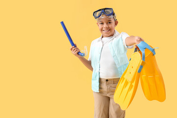 Poster - African-American little boy with snorkeling mask and flippers on yellow background