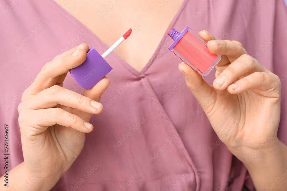 Woman with liquid lipstick, closeup