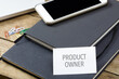 Product Owner text at business card on office desk
