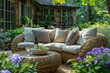A photo of an elegant outdoor seating area with comfortable cushions, a plush sofa and small round table set in the lush greenery of a garden.  Created with Ai