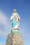 Fototapeta Kwiaty - MIETUSTWO, POLAND - MARCH 29, 2024: Statue of the Blessed Virgin Mary Queen of Poland in Mietustwo, Poland.