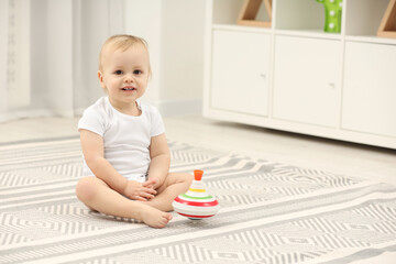 Sticker - Children toys. Cute little boy and spinning top on rug at home