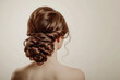 Classic and intricate braided updo hairstyle suitable for formal events, showcased on a woman