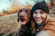 cute girl takes a selfie with her dog	