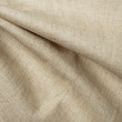 Texture, background, pattern. The fabric is knitted woolen beige color with a slight roughness