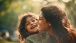 Close-up of an Indian mom having fun, having fun with her daughter outdoors in the park, forest, nature. Summer, Family, Positive Emotions, Happy Facial Expression concepts.
