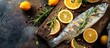 A raw fish is displayed on a wooden cutting board, surrounded by vibrant yellow lemons and fragrant rosemary sprigs.