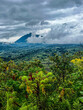 Volcano Bisoke (Virunga mountains) partly in clouds, portrait mode, Musanze, Kinigi, Rwanda 