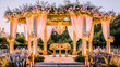 Elegant outdoor wedding setup with a floral decorated arch and chandeliers during a romantic sunset.