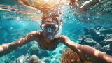 Fototapeta Do akwarium - Woman with mask snorkeling in clear water over vivid coral reef
