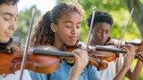 Fototapeta  - Jovens tocando violino ao ar livre