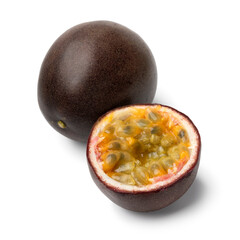 Wall Mural - Whole and halved fresh passion fruit close up isolated on white background