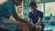 © Nayan - A physiotherapist gently massages a young athlete's injured knee, emphasizing trust and care in the rehabilitation process