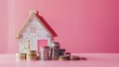 House and stacking coins and banknotes on pink background