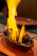 Fire-roasted chorizo ​​in a clay dish with alcohol, rum, chorizo ​​to hell.