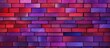 a red and purple brick wall with a blue brick in the middle