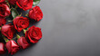 Red roses mock up banner on gray desktop background, top view