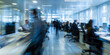 © smth.design - A blurred motion shot inside a busy office