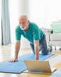  senior stretching exercise man training lifestyle sport fitness home healthy  pilates gym exercising fit laptop yoga meditation online class instruction