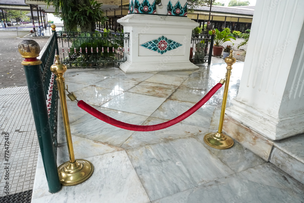 Stanchions and red velvet rope inside Keraton Yogyakarta also known as ...
