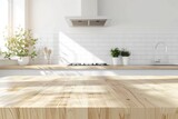 Fototapeta  - Empty wooden counter top in a clean white kitchen. Template showcase scene for advertising products