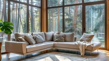 Beige Corner Sofa In A Modern Living Room With Large Windows And Forest View