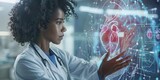 Fototapeta Londyn - Cardiology and cardiologist - Woman doctor examining a wireframe hologram of a heart