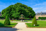 Fototapeta Uliczki - Place des Vosges (Place Royale) is the oldest planned square in Paris and one of the finest in the city. It is located in the Marais district in Paris, France