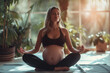 A young pregnant woman does yoga among the plants