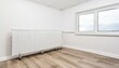 Modern Minimalism: White Aluminum Radiator and Laminate Floor in a Minimalistic Room