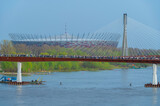 Fototapeta Tęcza - Most pieszo-rowerowy nad rzeką Wisłą, nowo otwarty w Warszawie, łączący Śródmieście z Pragą.
